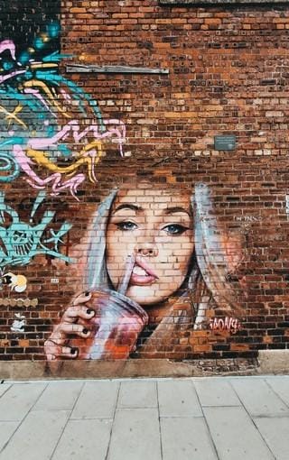 Test patch on brick wall showing gradients, solid block, and text